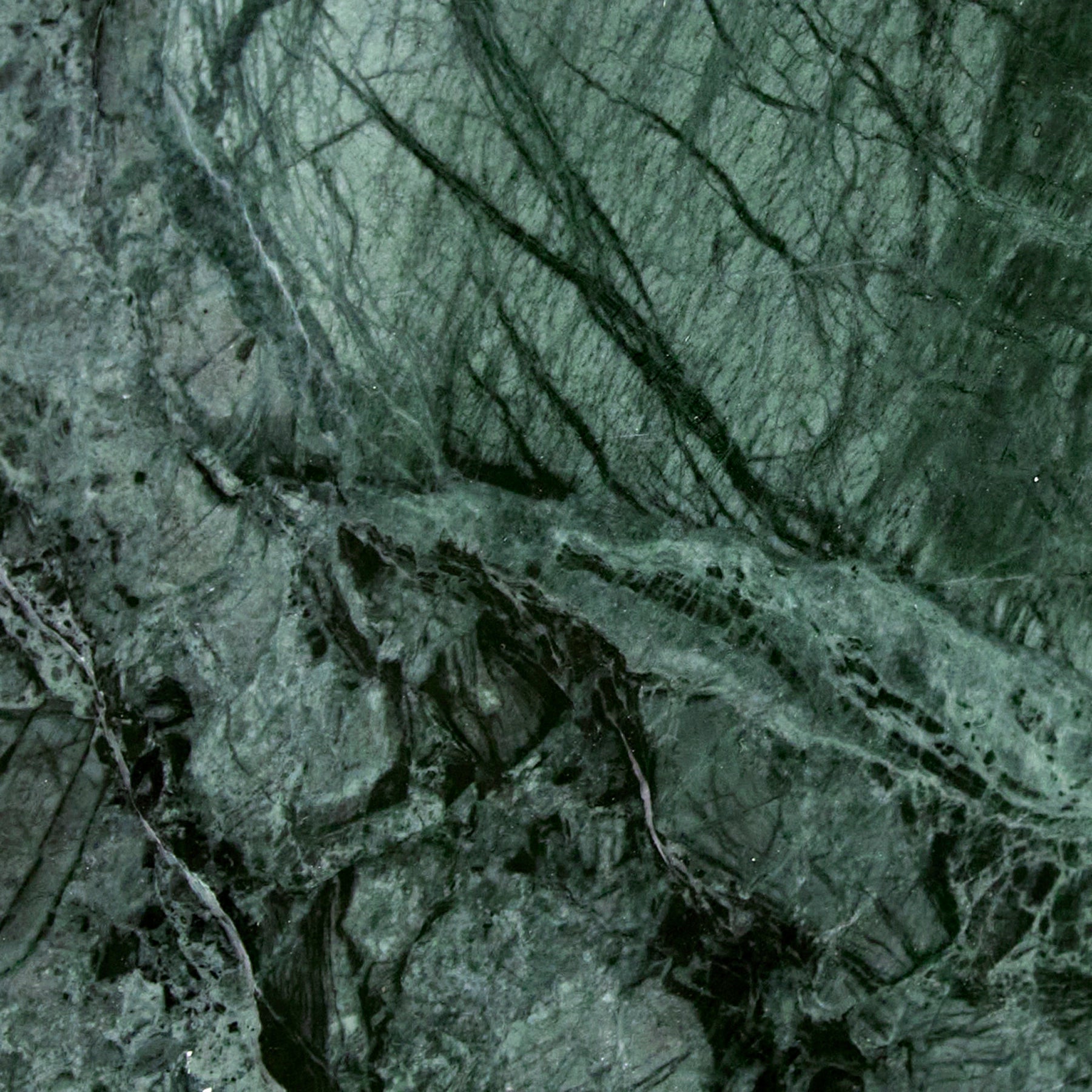 A close-up detail of Verde Guatemala marble.