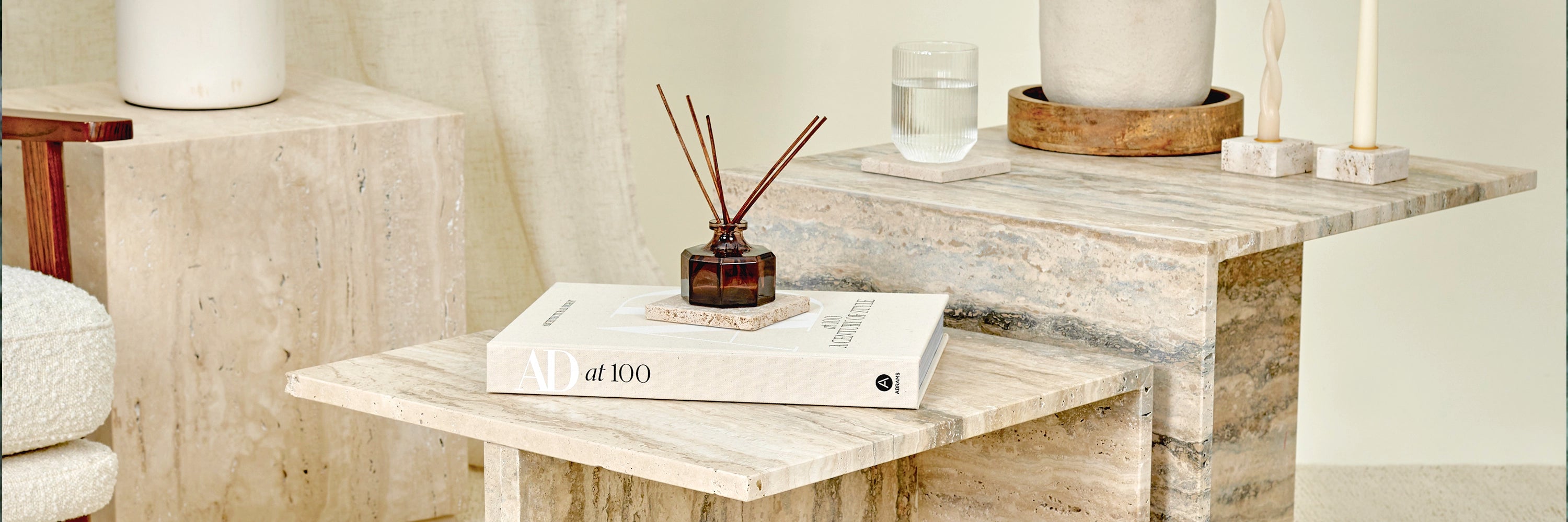 A collection of Travertine marble furniture and accessories.