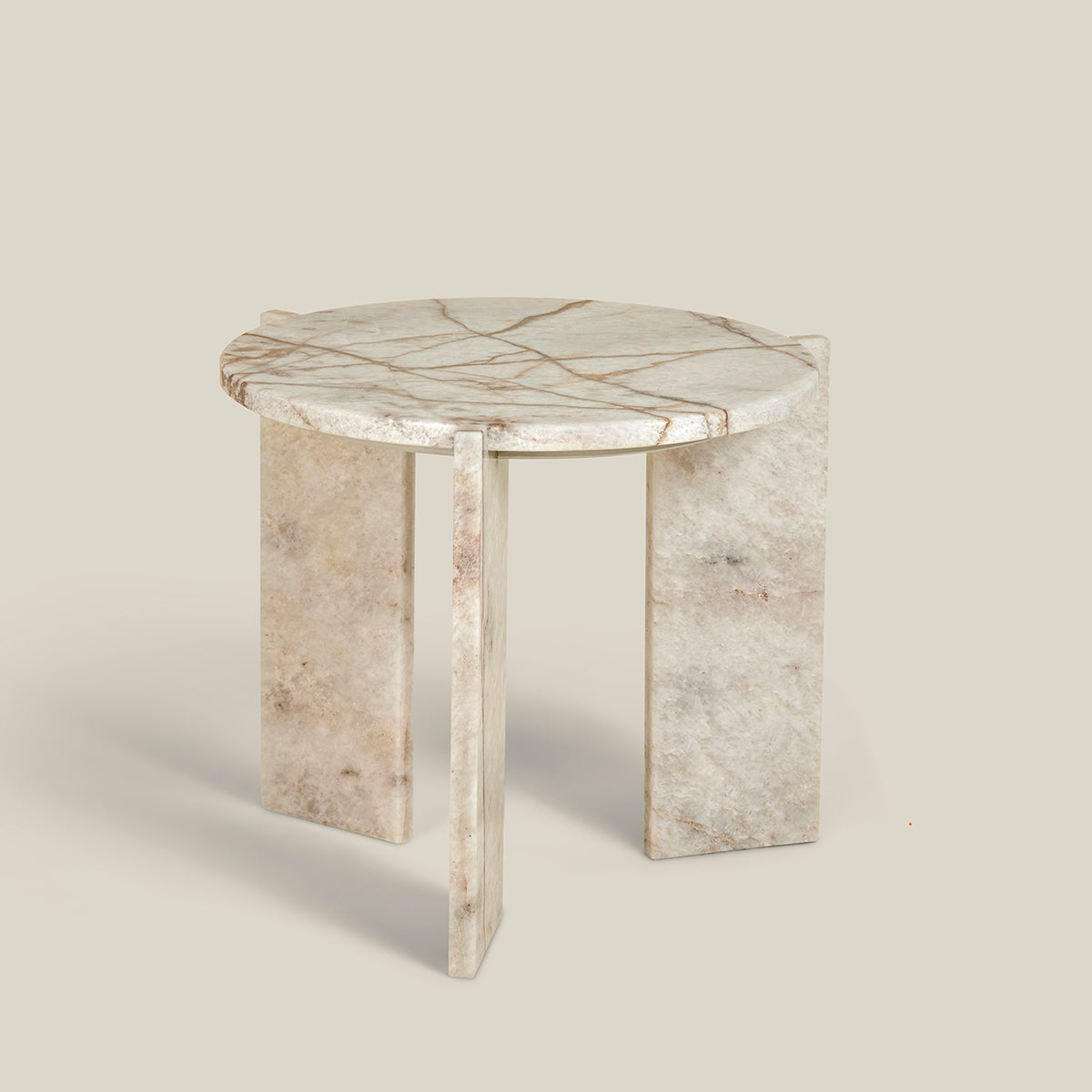 Minerva – a minimalistic, three-legged, round side table. Made from Cristallo Imperial-marble.