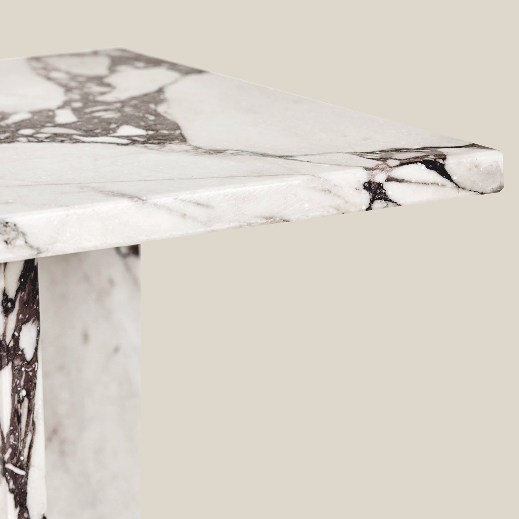 A corner detail of the Ava side table in  Arabescato Viola marble.