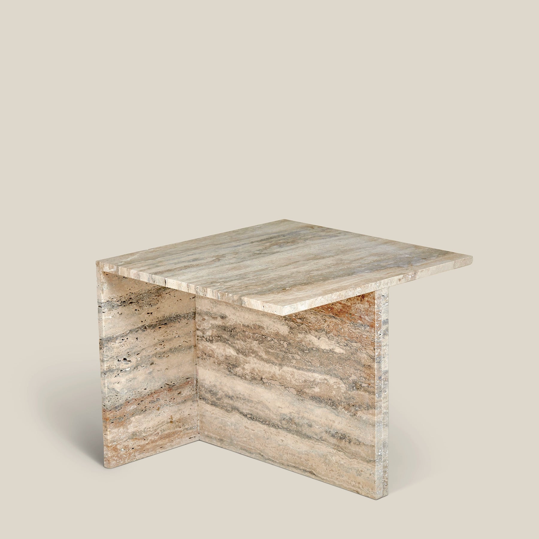 A modern Elba side table made from Travertine Romano marble – large.