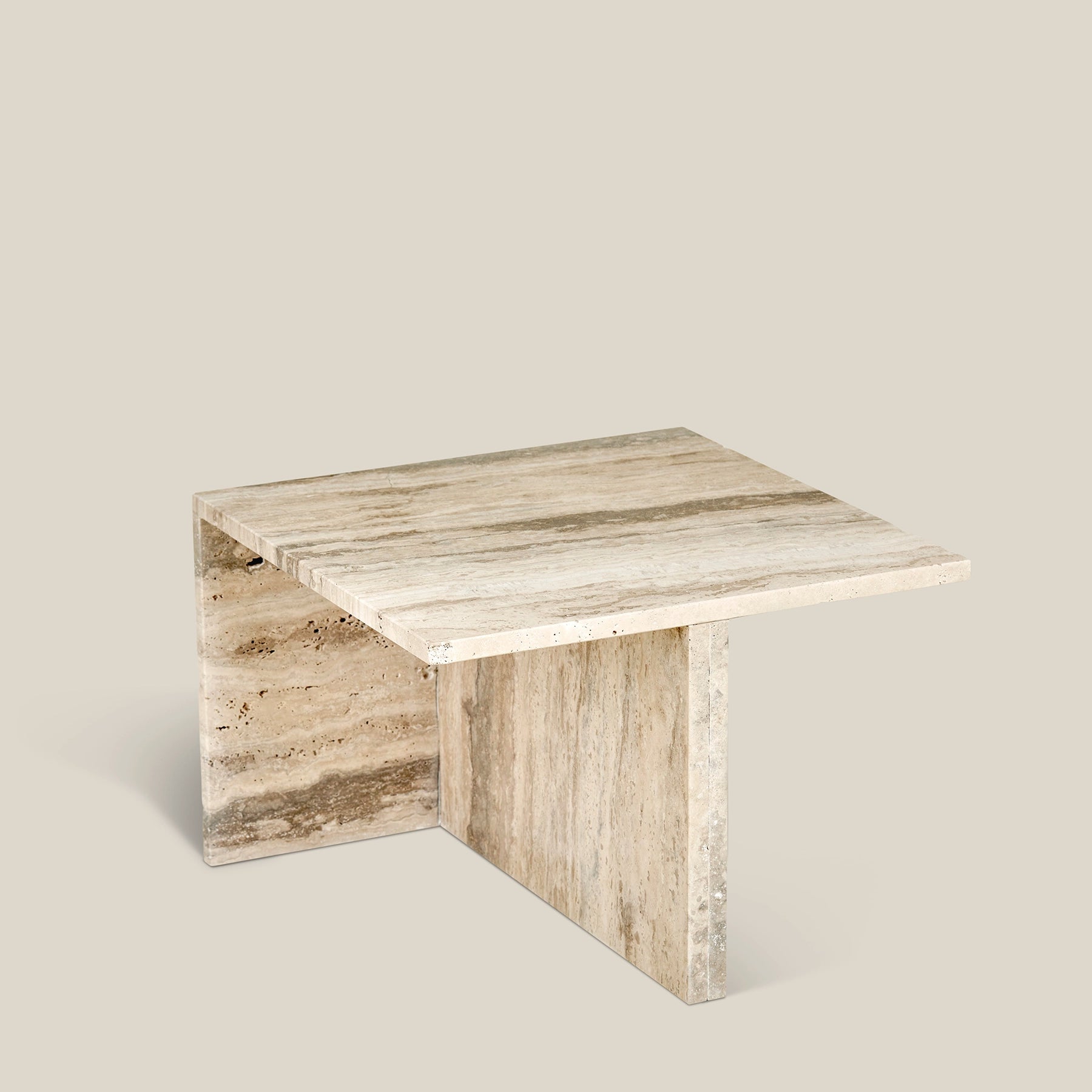 A modern Elba side table made from Travertine Romano marble – small.