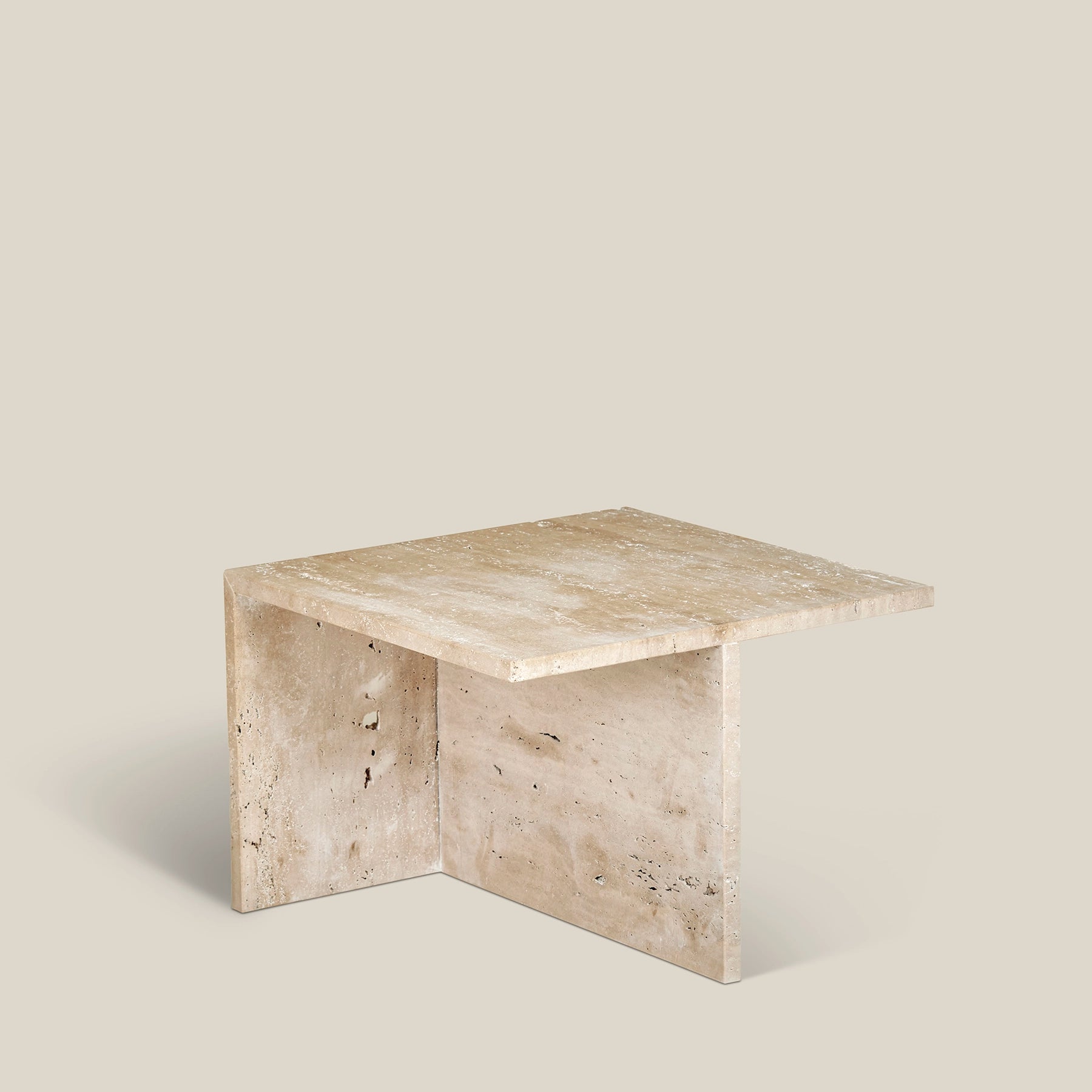 Simplistic Scandinavian Gianna side table made from Travertine Romano marble.