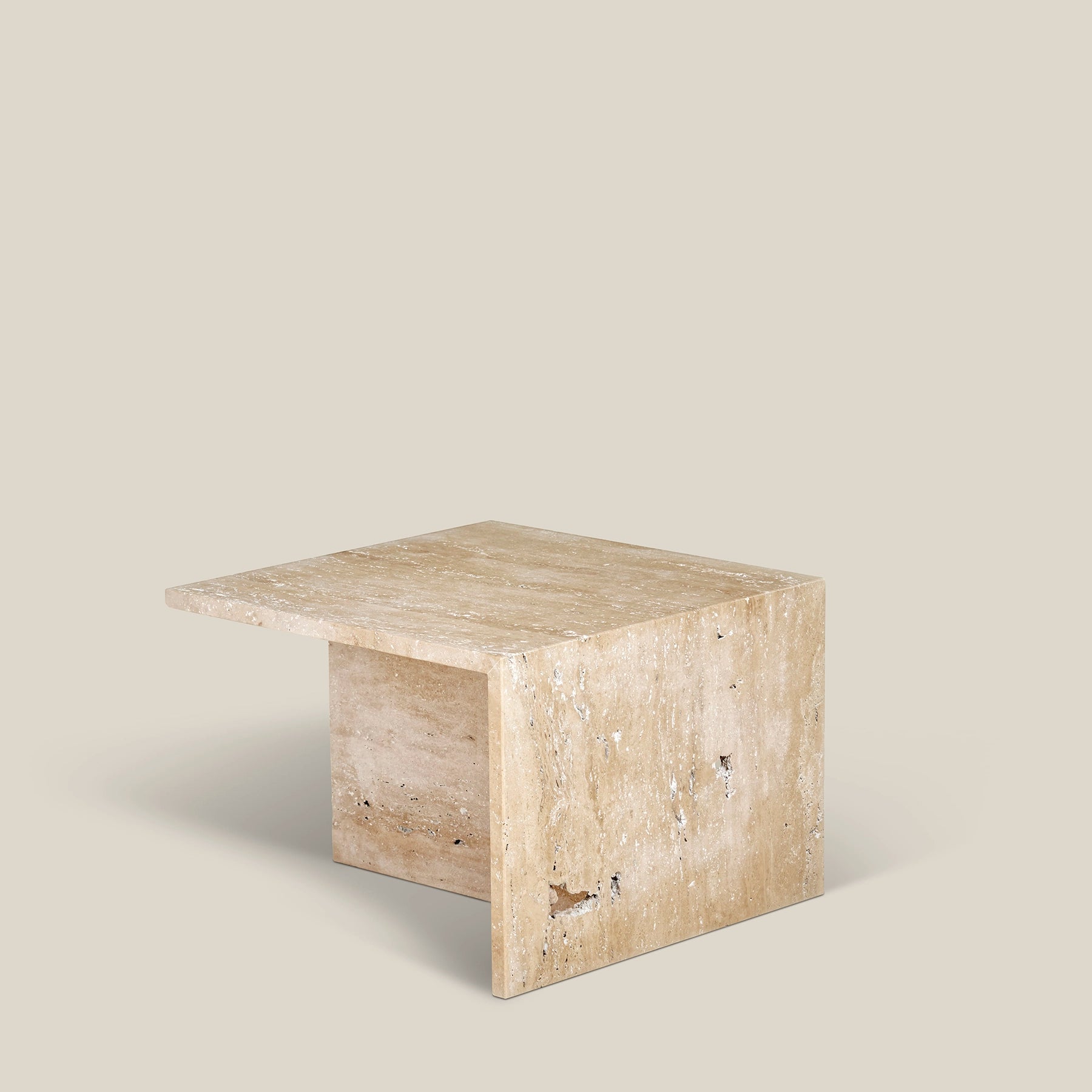 Simplistic Scandinavian Gianna side table made from Travertine Romano marble.