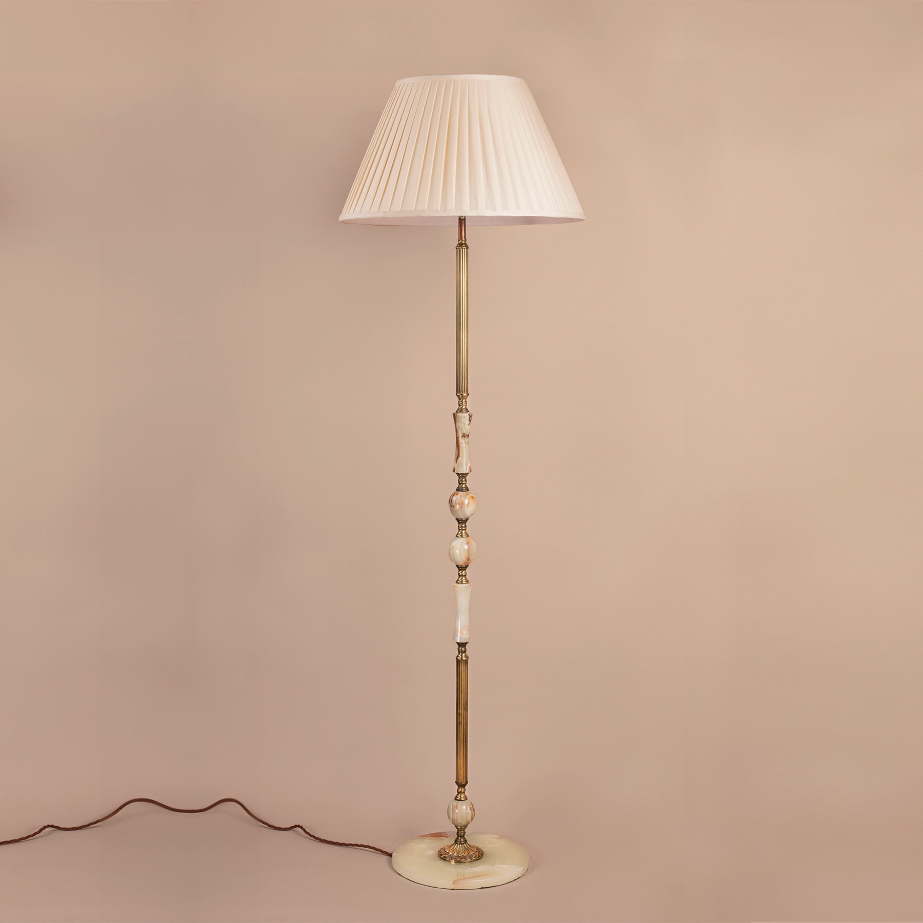 Mid-century onyx and antique brass floor lamp.