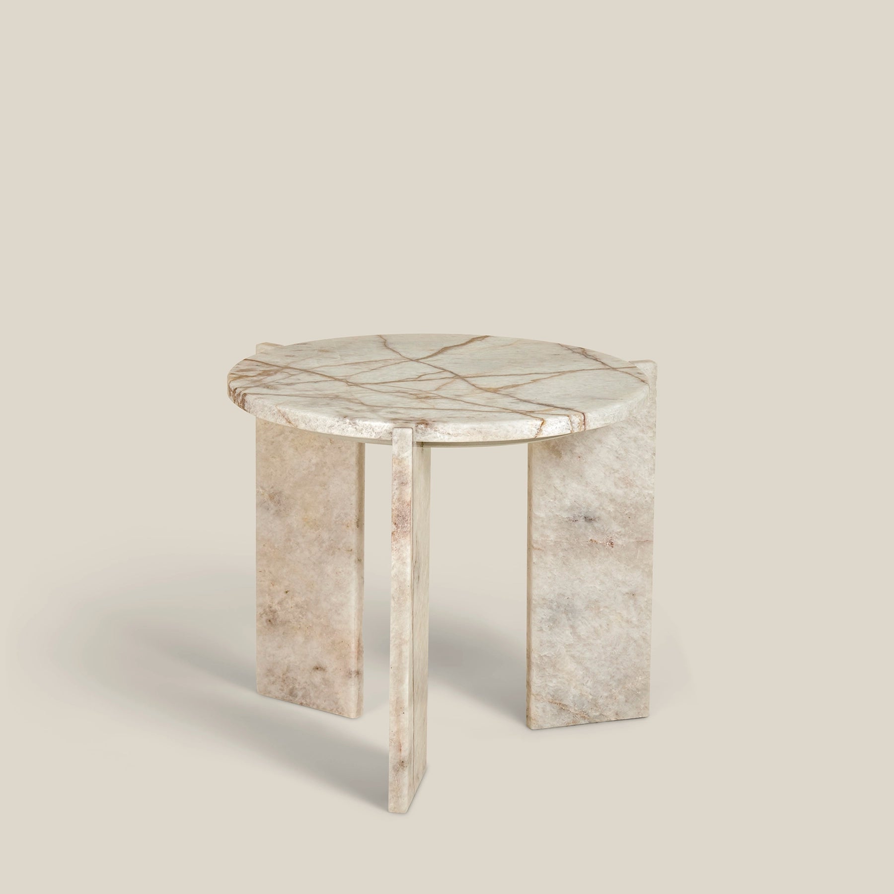 Minerva – a minimalistic, three-legged, round side table, made from Cristallo Imperial marble.