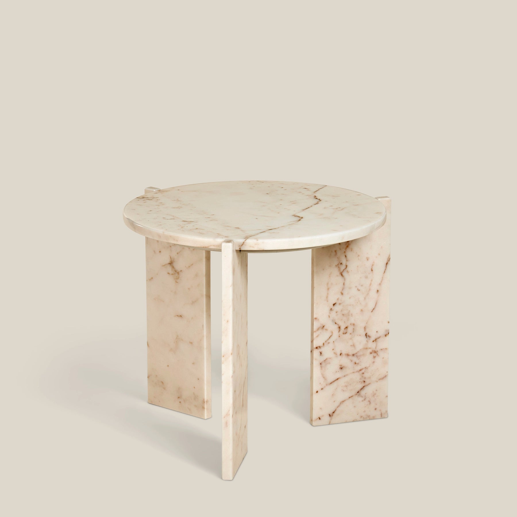 Minerva - a minimalistic, three-legged, round side table. Made from Rose Aurora marble.