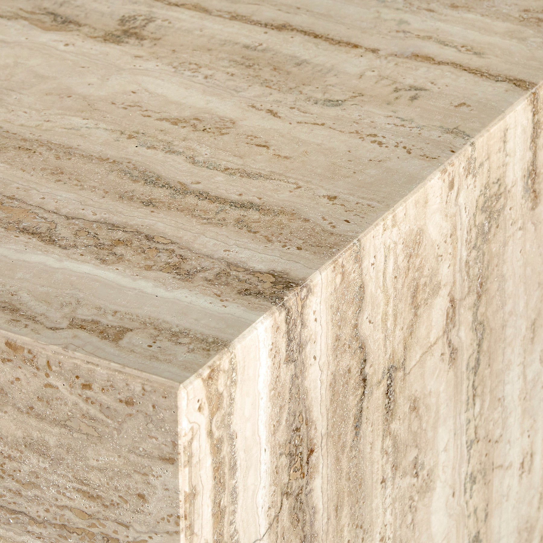 Detail of elegant travertine marble coffee table plinth.