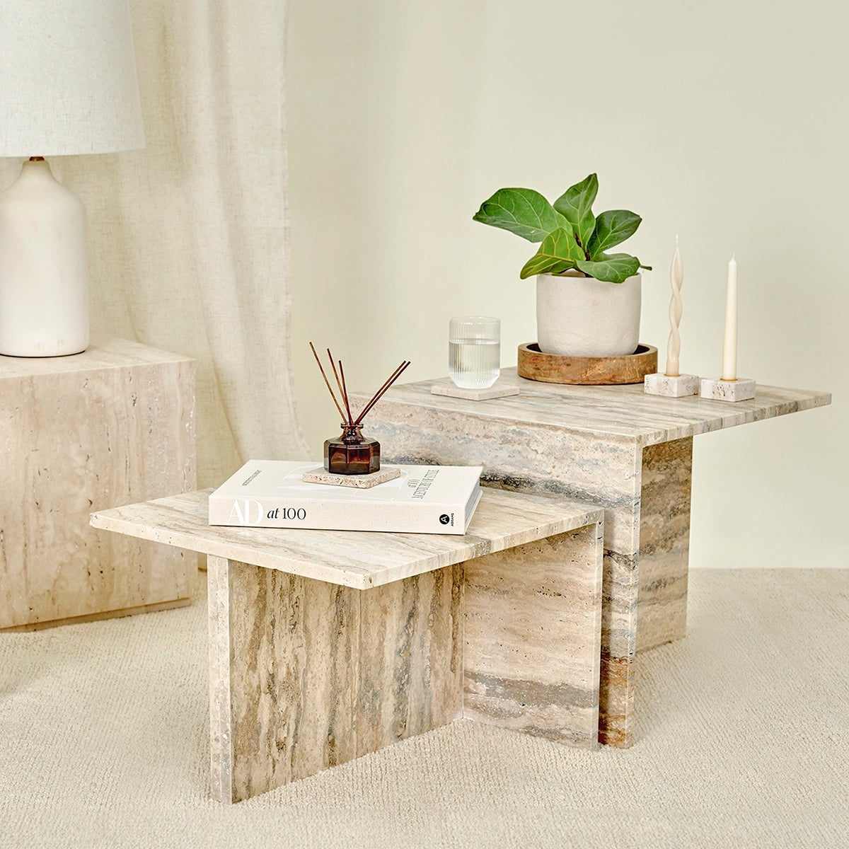 A collection of travertine marble furniture and accessories. 