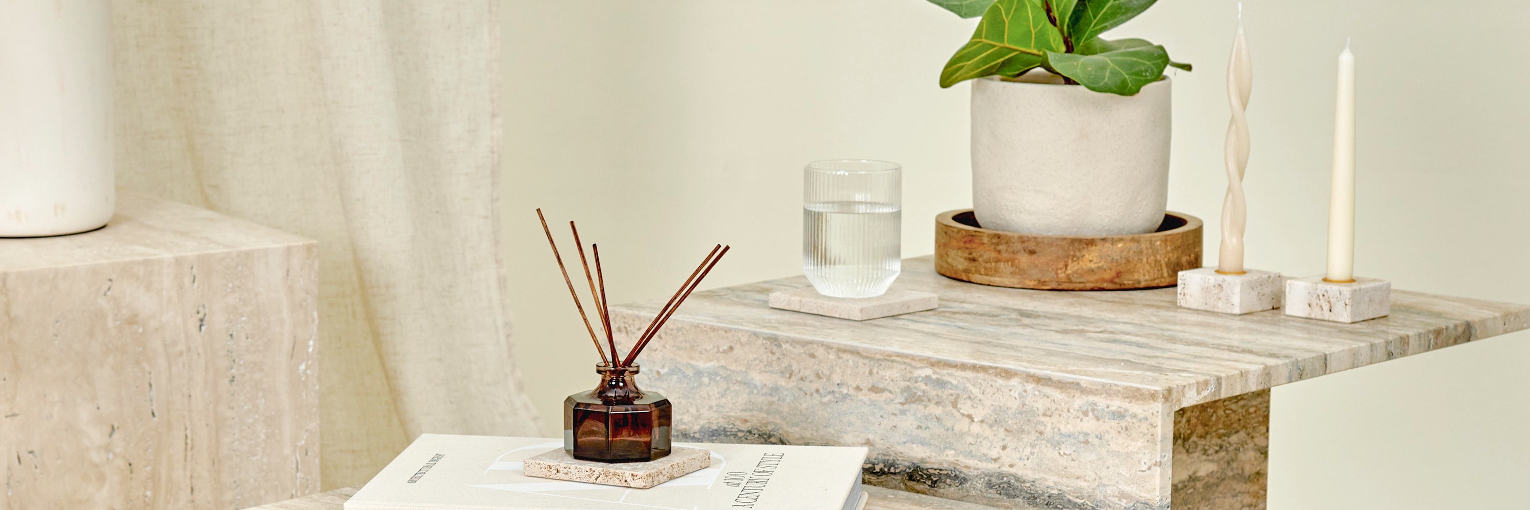 A close-up detail of Travertine marble furniture and accessories. 