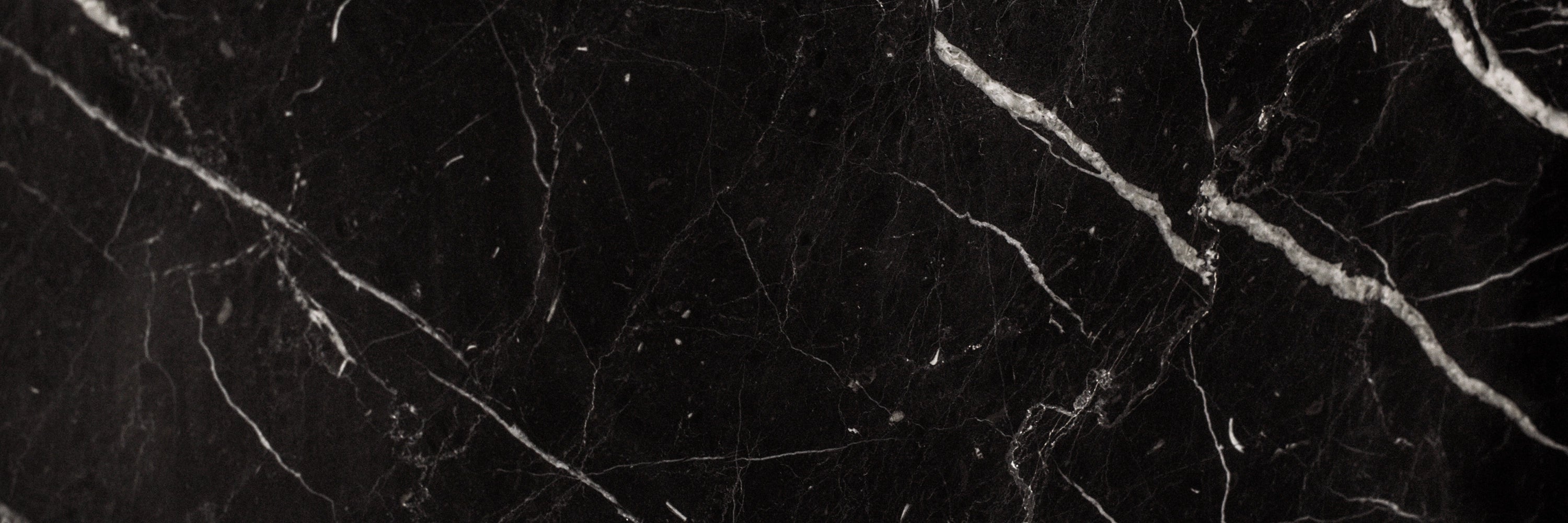 A close-up detail of Nero Marquina marble.