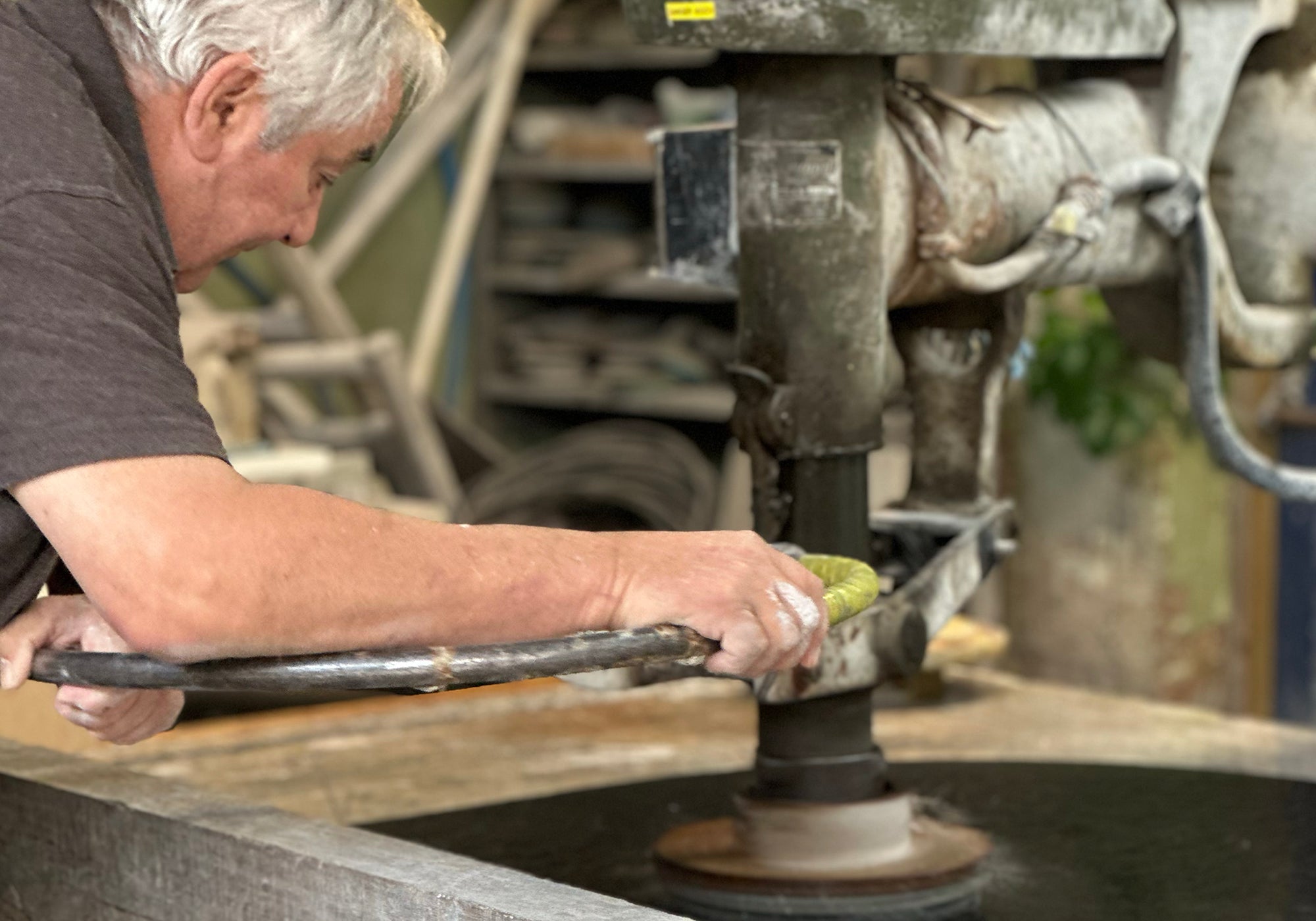 A close-up of marble being polished by hand in our UK workshop.